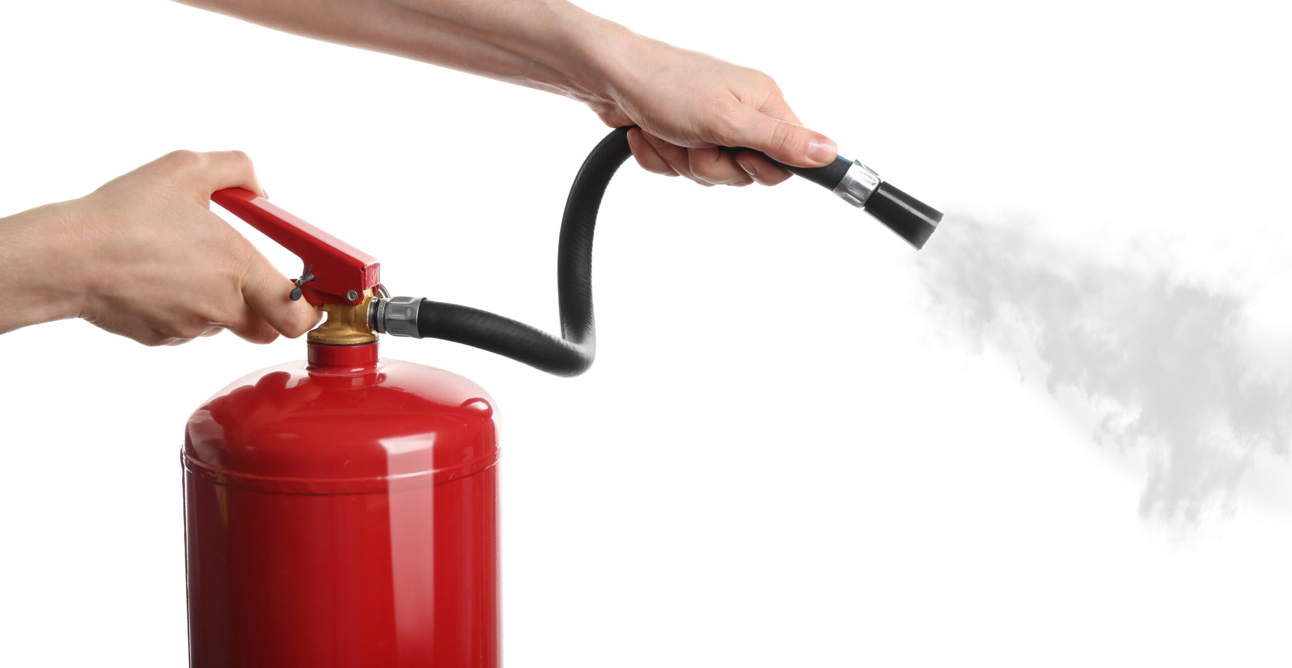 Woman using fire extinguisher on white background, closeup